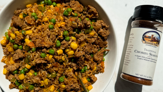 Bowl of Chorizo Dirty Rice made with lean meat and vegetables, served alongside a Shawhan Farms seasoning bottle for a bold, one-pan dinner recipe. Image by My Curated Tastes