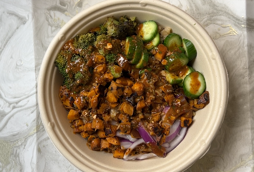 Sweet Potato, Red Onion, Cucumber, broccoli and rice in a bowl with Umami Sauce
