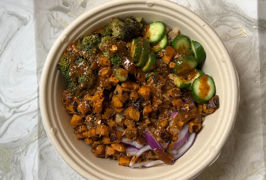 Sweet Potato, Red Onion, Cucumber, broccoli and rice in a bowl with Umami Sauce