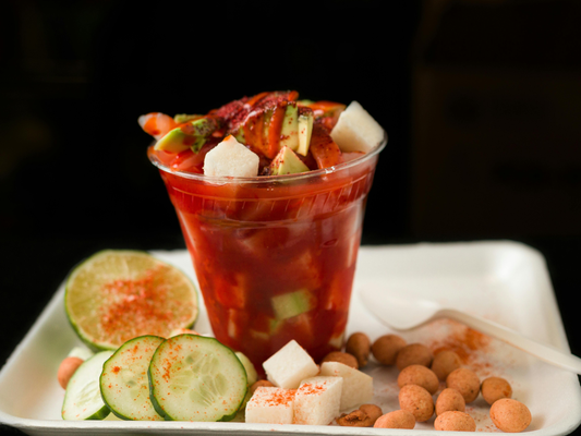 Chamoy in a cup with cucumber, coconut and other fruits