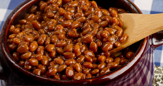 Deliciously baked beans in a brown sauce in a bean pot